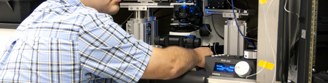Robison Lab Using Microscope